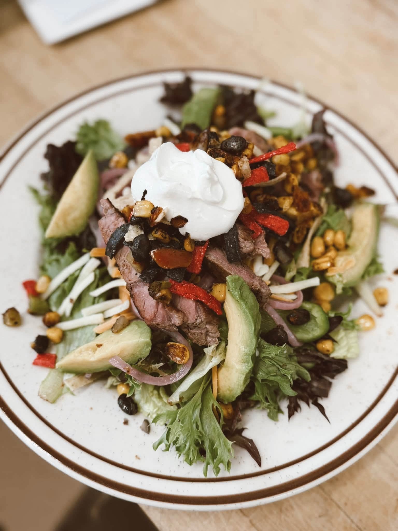 Seared steak salad with avocado at The Kove